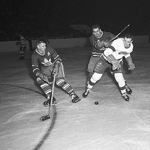 Jim Thomson & Gerry James team up to stop a Red Wing courtesy Hockey Hall of Fame